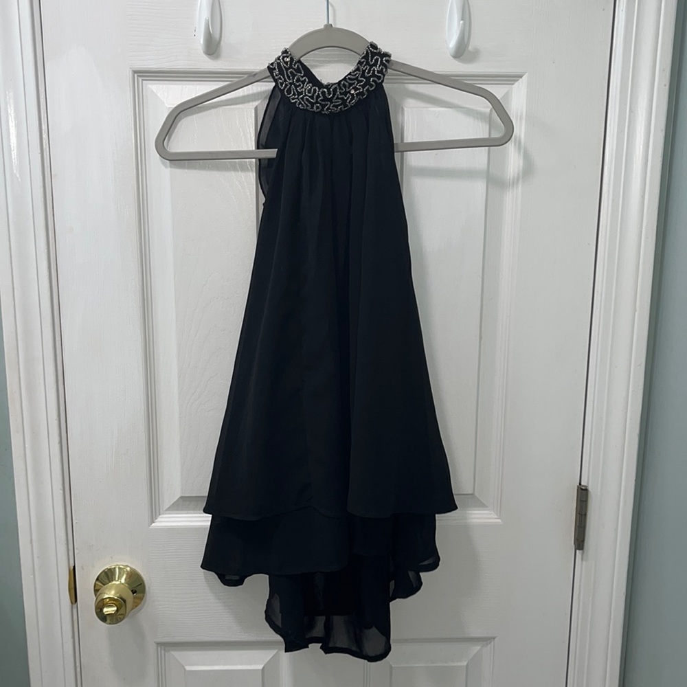 Truth NYC Size small black top with gorgeous beading and a fun ruffled back
